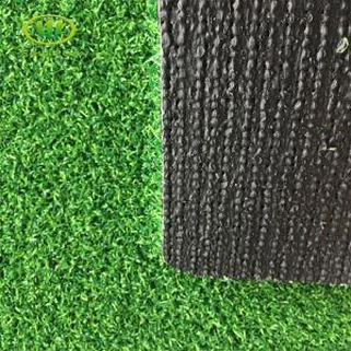 Golf-keinotekoinen ruoho vihreän ja parhaiten huolletun synteettisen turpeen